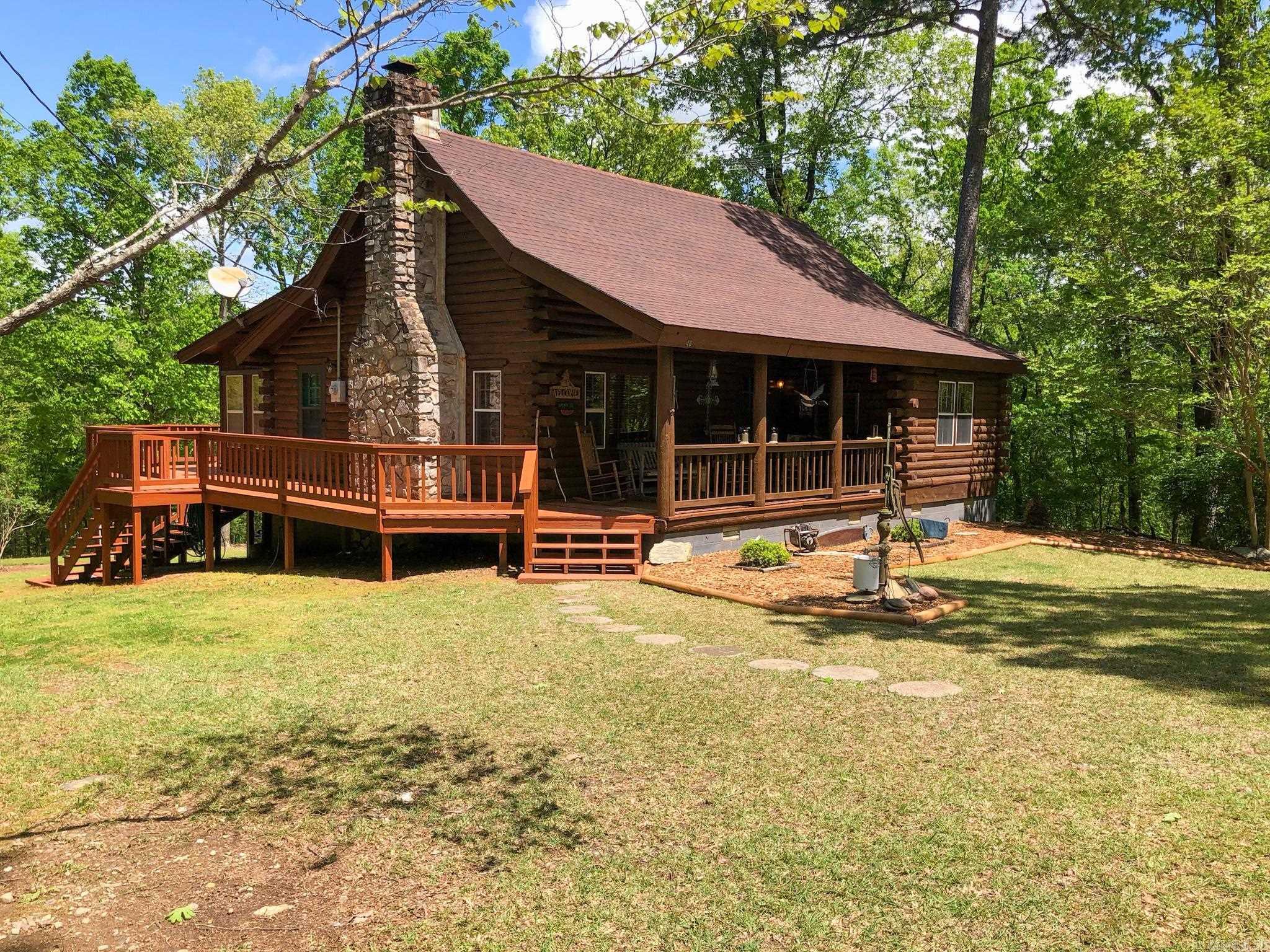 Welcome to your dream vacation destination, nestled in the serene beauty of the Ouachita National Forest! Our property offers the perfect blend of rustic charm and modern convenience, making it an ideal getaway for families, groups, or corporate retreats. Here's what makes our vacation rental truly special. Main Log Cabin sleeps up to 8 guests and features a warm and welcoming atmosphere with all the amenities you need for a comfortable stay. Bunkhouse sleeps up to 16 guests, ensuring everyone has a place to relax and unwind. Outdoor Kitchen: Cook up a feast in nature's embrace with our fully-equipped outdoor kitchen. Fire Pit with Seating: Gather around the fire pit for storytelling, roasting marshmallows, or simply enjoying the tranquil surroundings. Game Area: Engage in some friendly competition with games like badminton and corn hole, set against the backdrop of nature's beauty. Our vacation rental is a gateway to endless outdoor adventures: Explore the breathtaking trails and wildlife right at your doorstep. Ouachita River: Just a mile away, enjoy public access for fishing, swimming, canoeing, and kayaking.