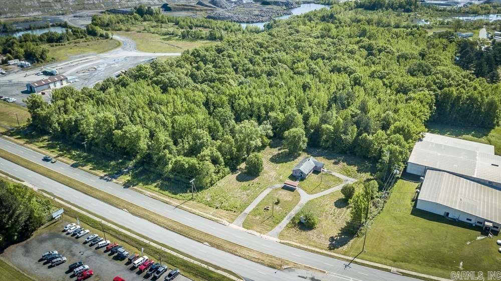 Almost 20 acres on Highway 5 with easy access to freeway. Over 600 feet of Highway 5 road frontage. Utilities on site include electric and city water. The is an old house on the property that conveys at no value.