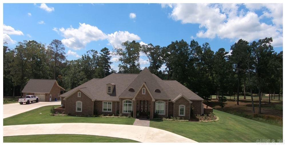 Spectacular custom built home that offers the ultimate setting for enjoying the best of golf course living. Located on the seventh hole this 4 or 5 bedroom, 3.5 bath home has stunning views with large open living spaces, culinary kitchen with Sub zero fridge, Viking stove and double oven, ice machine, & custom cabinetry. This home includes, a formal living room, dining room, den, office, game room, butlers pantry, extra large laundry room, & mud room. Luxurious master suite with spa inspired bath and shower. It includes his and her closets and water closets as well as a safe room.    Whole house generator, 2 car garage, shop with golf storage and a beautiful covered patio.    Please call Netasha at 870-866-9958 to see this exquisite home.