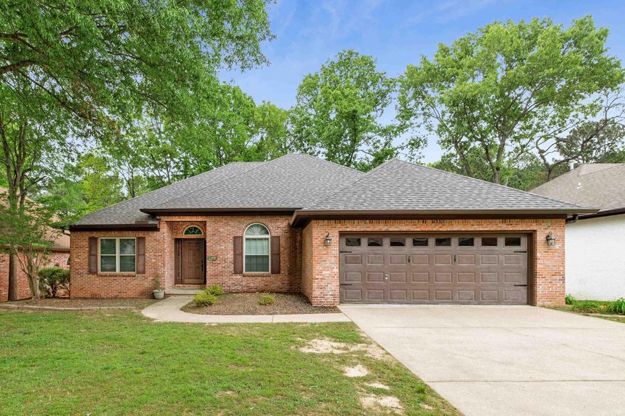Tucked in a quiet, family-friendly West Little Rock neighborhood zoned for highly rated Don Roberts Elementary (10/10 GreatSchools) and just minutes from The Promenade at Chenal, Costco, and I-430 for unbeatable convenience.  Step inside to a soaring arched foyer and beautiful hardwood floors that create an inviting first impression. The layout offers both function and flexibility with a formal dining room (perfect for an office or flex space) and an eat-in breakfast nook with bay windows that fill the home with natural light.  The updated kitchen features granite countertops and subway tile backsplash, while the oversized primary suite with tray ceiling provides a true retreat. Secondary bedrooms are generously sized with large closets, including one with a custom built-in bookcase wall, ideal for a home office, library, or creative space.  Out back, enjoy a spacious deck overlooking peaceful wooded greenspace, offering privacy and a quiet setting that’s hard to find in this price point. Don't miss it!  No HOA. Brand new roof, gutters and downspouts, with repaired and serviced HVAC system (April 2026).  Note: Select photos have been virtually staged. See Agent Remarks