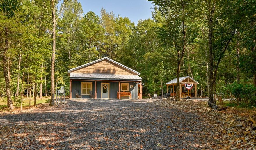 GORGEOUS, recently built, fully furnished 3bed/2.5bath house currently being run as a successful Short Term Rental! Located in highly sought after Shady, AR this dwelling is minutes from the Wolf Pen Gap Trail System with easy trail access to Caney Creek, Little Missouri Falls and more! Features include stunning VAULTED CEILINGS, BRAND-NEW fixtures, cabinetry and appliances, attractive new furniture, a fantastic covered OUTDOOR AREA,  outdoor shower, fire pit and so much more! This cabin is also listed with a country store and restaurant business under MLS: 25038546