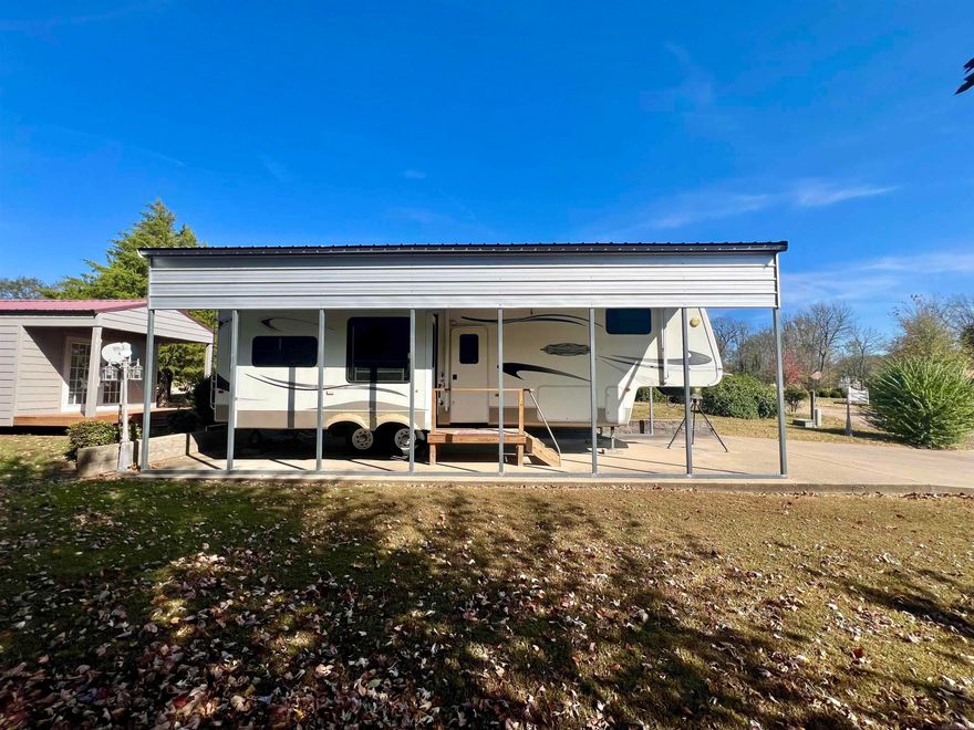 This 0.2-acre lot is centrally located in Mountain View, in the Pebble Creek subdivision. The property will include a 2007 Keys Camper Trailer, as well as an outdoor storage building. The Keys camper trailer will come with everything inside included. The property is just a short drive away from The White River, The Ozark Folk Center State Park, and Blanchard Springs Caverns. It is also very close to downtown Mountain View, where the world-famous folk music is being played on most weekend summer nights. The town of Mountain View has a lot to offer, including hiking, fishing, hunting, horseback riding, boat/raft/kayak rentals, a 9-hole golf course, restaurants, shopping, a movie theater and so much more. Call today to set up your appointment, don't miss out on this beautiful property.