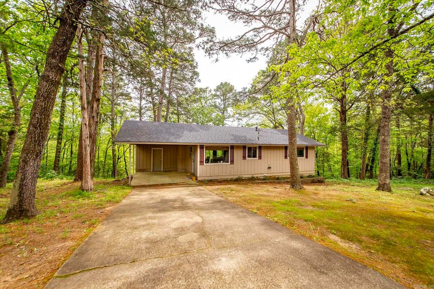 Welcome to your weekend retreat! This charming home has been recently updated with a new roof, HVAC, light fixtures, & interior paint.  Fairfield Bay Marina is 5 min. away. Nice vaulted ceiling with wood beam in the living room. Open living/kitchen area.  Covered back deck to enjoy tranquility & serene outdoor nature. Work shop area in the lower level. perfect space to unleash your creativity and bring your ideas to life. It's an ideal setup for those who enjoy hands-on activities or need a dedicated space for hobbies. Take advantage of the path that leads to the lake to go kayaking. Access to Bay Amenities: Embrace the convenient lifestyle offered by this home's proximity to the amenities of the bay. Indulge in the nearby recreational facilities, including golf courses, tennis courts, pickle ball courts, hiking trails, and more. This location ensures there's never a dull moment, catering to your desire for both relaxation and adventure. New windows in the crawl space that were never installed will convey.