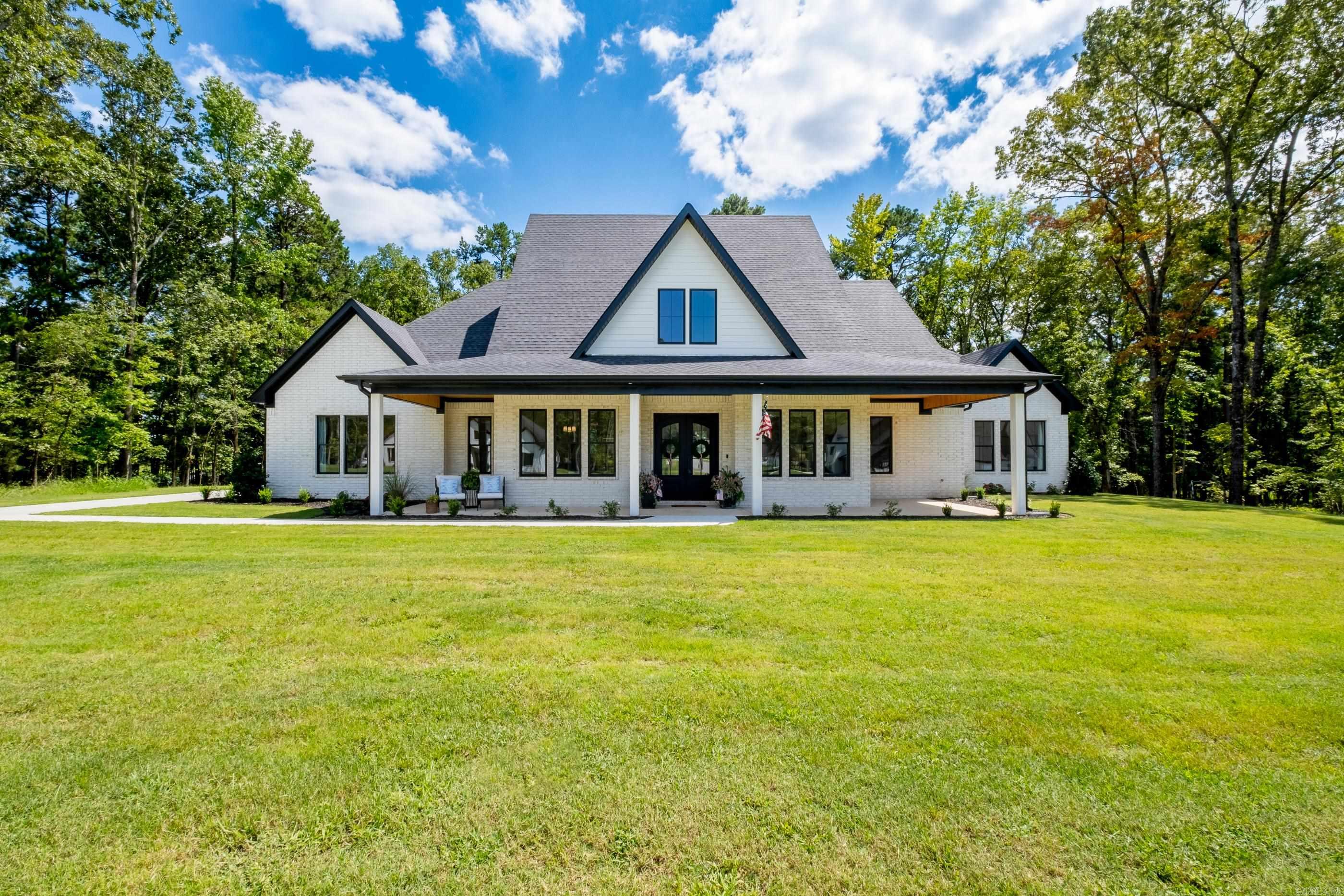 Welcome to your dream home! Nestled on over an acre of land, this newly constructed gem offers the perfect blend of luxury and comfort. The main level features four spacious bedrooms and an office area, each designed with contemporary elegance and ample natural light. The open-concept floor plan seamlessly connects the living area, dining space, and gourmet kitchen, creating an inviting atmosphere for family gatherings and entertaining guests. Upstairs, you'll find a versatile bonus room with its own bathroom, ideal for use as a fifth bedroom, kid’s play area, or guest suite. The outdoor space is equally impressive, boasting a large, level lot perfect for outdoor activities and relaxation. The screened-in patio and outdoor kitchen with a fireplace provide an exceptional setting for alfresco dining and cozy evenings under the stars. Don't miss the opportunity to make this exquisite property your forever home!