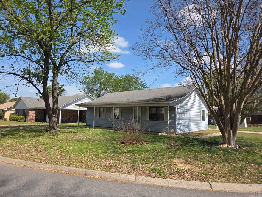 Very well kept, ranch stye 3-bedroom, 2 bath house with full length front porch in West Searcy & close to shopping, churches, grocery stores, gas stations & more. The HVAC was replaced in 2023 & is under warranty. No carpet, all hard surface floors with newer woodgrain plank look ceramic tile in most of the house with original ceramic tile flooring in kitchen, laundry, dining & bath built on a slab. The refrigerator will stay with all other kitchen appliances. Window blinds, ceiling fans, spacious living room & separate opposing washer & dryer sides in laundry room off the kitchen. Would make a nice starter home or investment property. Appointment only with 24-hour tenant notice. See agent remarks.