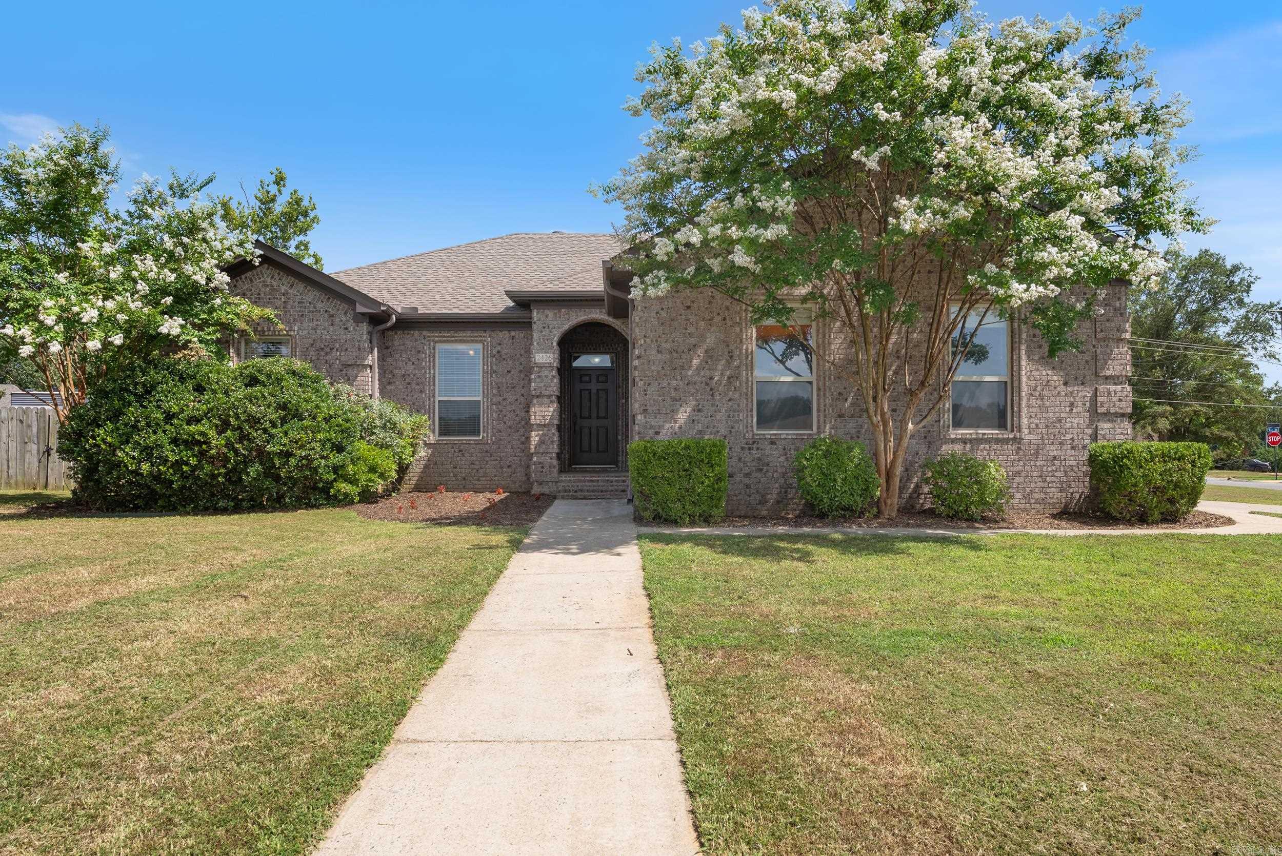 Welcome to this beautifully maintained 3 bedroom, 2 bath home on a spacious corner lot! This split floor plan offers both privacy and functionality, complemented by 9 foot ceilings throughout. The living room features a cozy gas fireplace and built in shelving, while the kitchen is equipped with a large island, granite countertops and a brand new dishwasher. The refrigerator conveys, making moving in even easier! Enjoy outdoor living in the large backyard, complete with a permanent gas line for your grill- perfect for summer cook outs. A roomy garage provides plenty of storage and recent updates including a NEW ROOF and HVAC System offer added peace of mind!! Don't miss your chance to see this house!