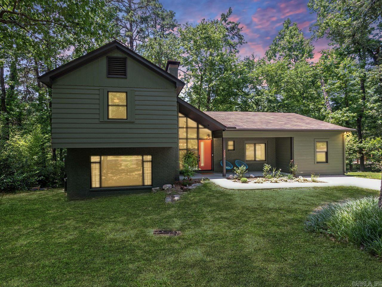 Discover elegant Mid-Century Modern ranch-styled 3BR, 2BA home spanning 2,061 sf. Professionally painted inside and out with high-quality Sherwin-Williams, less than 1 yr. This home boasts new fixtures, fans, and plenty of natural light. Updated epicurean kitchen featuring stainless steel appliances less than 2 y.o. to include induction range w/air fry oven, LG French door frig, dishwasher, microwave and a leathered granite countertop. A spectacular outdoor dining deck off the kitchen, an eat-in kitchen, and a separate dining room. Tri-level home offering a spacious den w/wood burning fireplace, perfect for cozy evenings. Upstairs 2BR, one w/outside deck including top of line, hot tub (4 yr wnty left). Extra attic storage providing secure convenience. Lowest level displays a utility room w/washer and dryer & a bonus room. The roof is 5 y.o., the HVAC is 10 y.o., and extra mini-split is 2 y.o. (3 yr wnty left) for plenty of comfort and efficiency. Live in this elegant home with every detail considered. Minutes from HSNP bathhouse row, dining, and shopping. Don't miss the chance to live in this quiet, park-like setting w/overview of a wet weather creek. Schedule a private tour today!