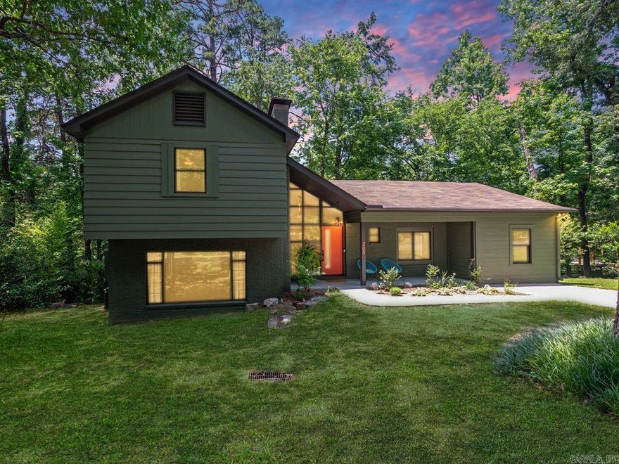 Discover elegant Mid-Century Modern ranch-styled 3BR, 2BA home spanning 2,061 sf. Professionally painted inside and out with high-quality Sherwin-Williams, less than 1 yr. This home boasts new fixtures, fans, and plenty of natural light. Updated epicurean kitchen featuring stainless steel appliances less than 2 y.o. to include induction range w/air fry oven, LG French door frig, dishwasher, microwave and a leathered granite countertop. A spectacular outdoor dining deck off the kitchen, an eat-in kitchen, and a separate dining room. Tri-level home offering a spacious den w/wood burning fireplace, perfect for cozy evenings. Upstairs 2BR, one w/outside deck including top of line, hot tub (4 yr wnty left). Extra attic storage providing secure convenience. Lowest level displays a utility room w/washer and dryer & a bonus room. The roof is 5 y.o., the HVAC is 10 y.o., and extra mini-split is 2 y.o. (3 yr wnty left) for plenty of comfort and efficiency. Live in this elegant home with every detail considered. Minutes from HSNP bathhouse row, dining, and shopping. Don't miss the chance to live in this quiet, park-like setting w/overview of a wet weather creek. Schedule a private tour today!