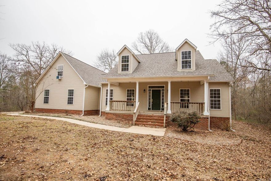 If your vibe is: "I don't want to see the neighbor's house.", " I don't want people to see my house from the road." or " I want to be able to hunt out of my own back yard." then this is the perfect place for you to call home! Sitting on nearly 7.5 acres of beautiful hardwoods, this 3 bedroom home has 2 full bathrooms and 2 half bathrooms and a large room upstairs that is perfect for a game room or your teenager who is always wanting more privacy. Notable features include a cozy gas fireplace, large shop, new carpet downstairs, and plenty of wildlife. Roof and HVAC 2025. Schedule your showing today!