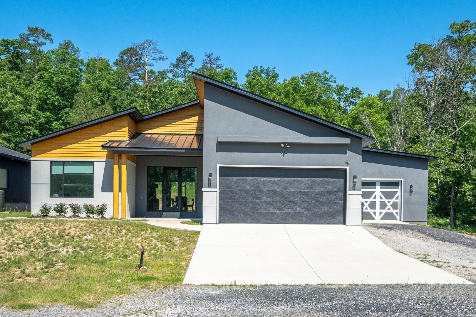 Stunning Mountain Modern Retreat on 2.94 Acres ā Minutes from Historic Downtown Hot Springs. Experience the perfect blend of contemporary elegance and natural beauty in this breathtaking Mountain Modern home, just 3.6 miles from Historic Downtown Hot Springs. Nestled on 2.94 private acres, this property offers a serene retreat while remaining conveniently close to the cityās vibrant amenities. Step inside to an open-concept design featuring soaring vaulted ceilings, a neutral color palette, and abundant natural light. The heart of the home is the expansive living, dining, and kitchen area, anchored by a striking fireplace. The kitchen is a dream, complete with custom cabinetry, a spacious island, and a walk-in pantryāperfect for entertaining and everyday living. The luxurious primary suite is a true sanctuary, boasting a spa-like ensuite with a walk-in shower and a huge custom walk-in closet with built-ins. Generously sized guest bedrooms also feature excellent closet space. High-end touches throughout the home include heated floors and designer light fixtures, adding both comfort and style. Continued -