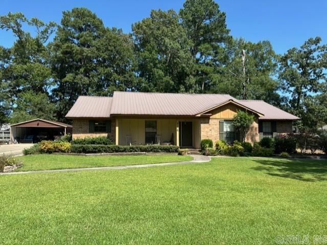 3 bed/2 bath brick home with 2268 sq ft in Oak Manor subdivision real oak planks on floor, Craft wood stove with blower separate utility with washer/dryer Built-ins in den and hallway Outside storage 14 x 32 Open garage 24 x 30 with 8' ceiling