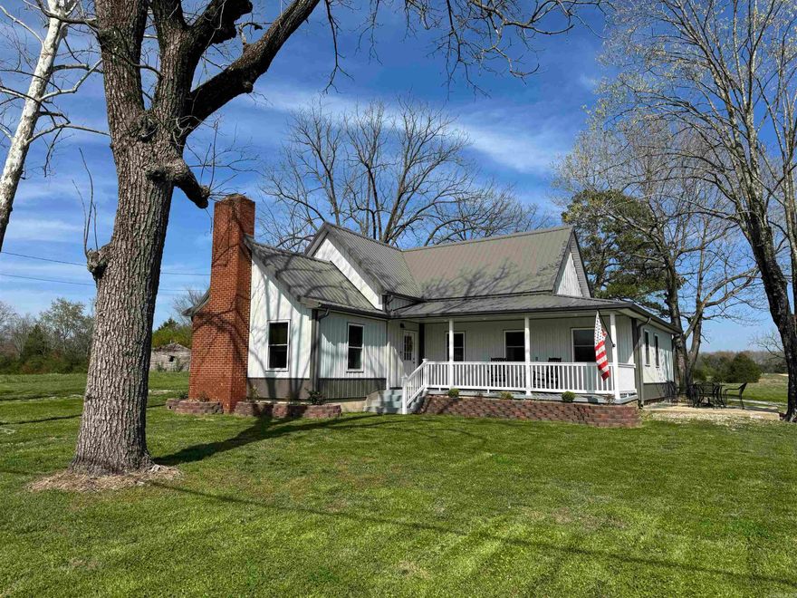 A completely remodeled older farmhouse in historic Mountain View, Arkansas, sits on 1.18 acres and offers the perfect blend of charm and modern comfort. The home features three spacious bedrooms with large closets, two beautifully updated bathrooms with walk-in showers, and a fully finished open-concept living area with a newly installed electric fireplace. The kitchen, bathrooms, and laundry room are highlighted with elegant granite countertops and new cabinetry, providing both style and function. The exterior has been refreshed with new siding, fresh paint, landscaping, and a durable metal roof installed in 2023. A new HVAC system was also added the same year for worry-free living. Outside, a 36 x 23 fully wired shop with a half bathroom offers exceptional space for projects or hobbies, while the detached two-car garage adds additional parking and storage. A storm shelter provides peace of mind during Arkansas weather.