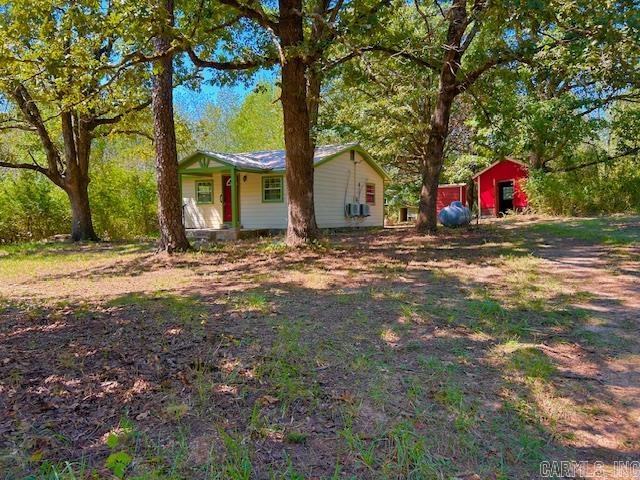 Charming 1 bedroom 1 bath home on almost 5 acres of great land near the Little Red River. There is lots closet space and a nice laundry area as well. Escape to the peaceful countryside in Fox, Arkansas. Just minutes from the little Red River, this property offers the perfect blend of privacy and convenience. Only a short drive to local stores, the post office, Park and the Fox School. The land features a barn and a separate storage building, offering plenty of space for a hobby farm, workshop or weekend retreat. Enjoy quiet mornings on the porch, watching deer wander by and listing to the sounds of nature. Only 30 minutes to Mountain View, The Folk Music Capital of the World, where you can enjoy live music on the Courthouse Square, seasonal festivals, and a welcoming small town atmosphere year- round. Call to schedule your own tour today! It could be the one you have been looking for.