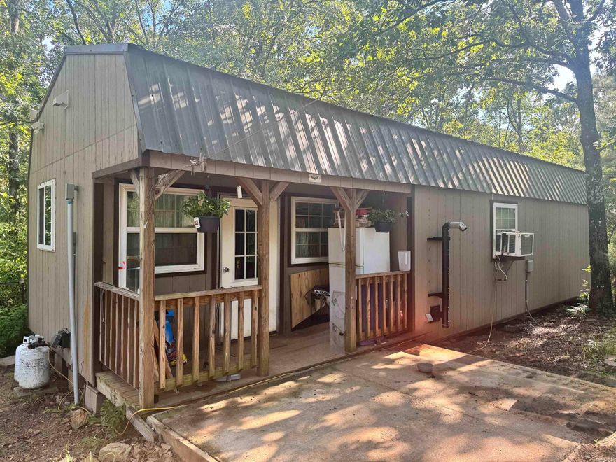 Escape the hustle and bustle on over 4 acres of unrestricted wooded bliss! Surrounded by towering trees and wildlife, this is a perfect combination of a homestead and hunting ground.  This private land has a charming 640 sq ft modular building that has been updated.  Seller has installed new countertops & cabinets. All appliances convey with the property, including the washer & dryer.  Don't miss your chance to own a slice of the peaceful life.  Priced to sell! AGENTS: Please see remarks.