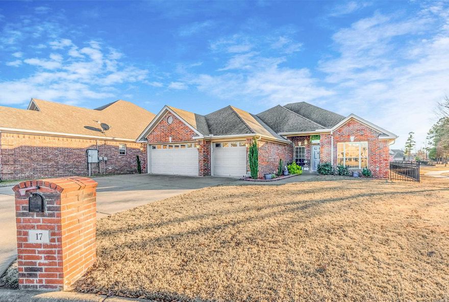 This beautifully maintained home is located at the end of a quiet cul de sac. The home offers an open floor plan with a gas log fireplace and vaulted ceilings.  The kitchen includes a gas stove, corian countertops, a pantry and the refrigerator conveys with the sale of the home.  Engineered hardwoods in dining room, one guest bedroom and the walkways of the home.  New LVT flooring in two guest bedrooms.  Primary bedroom has a tray ceiling and bay window perfect for a reading area.  The primary bath has double sinks, two walk in closets, jetted tub and a separate shower.   A 17' x 17' covered patio was recently added to enjoy  views out the back of the home.  Backyard is fully fenced with aluminum fencing. The home abuts a green space. Two west facing windows have remote controlled SunSetter Awnings. The three car garage includes a built in workbench with pegboard, insulated garage doors, painted floor and a partially floored attic.  The home has a brick exterior and gutters.