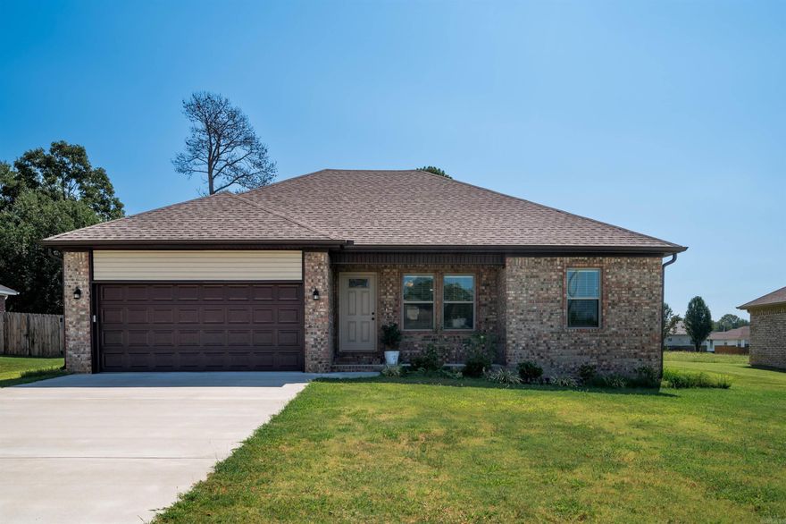 Great all brick home with an open floor plan. The kitchen features stainless appliances, granite countertops with tiled backsplash, custom cabinets and breakfast bar. The living room is open to the kitchen and the secondary bedrooms are split from the primary. Primary bath has double vanity too! LVP flooring in common areas, tile in laundry and baths.