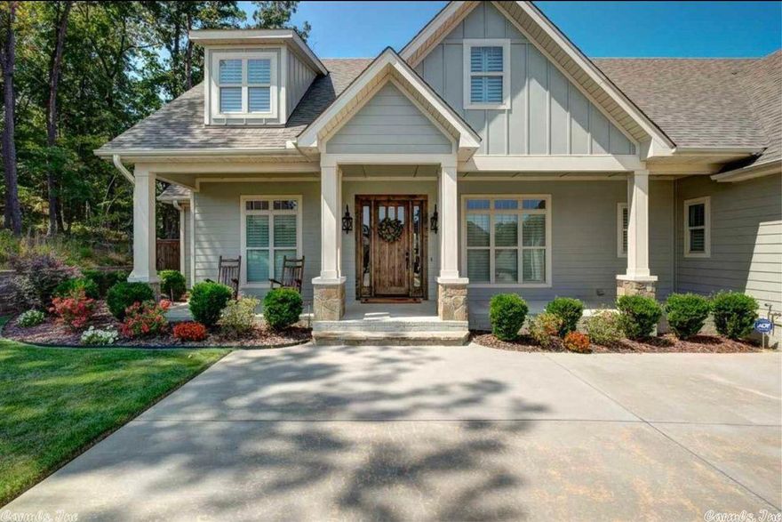 This is a 5 bed, 3.5 bath home features an open floor plan with vaulted ceilings with wood beams in a culdesac