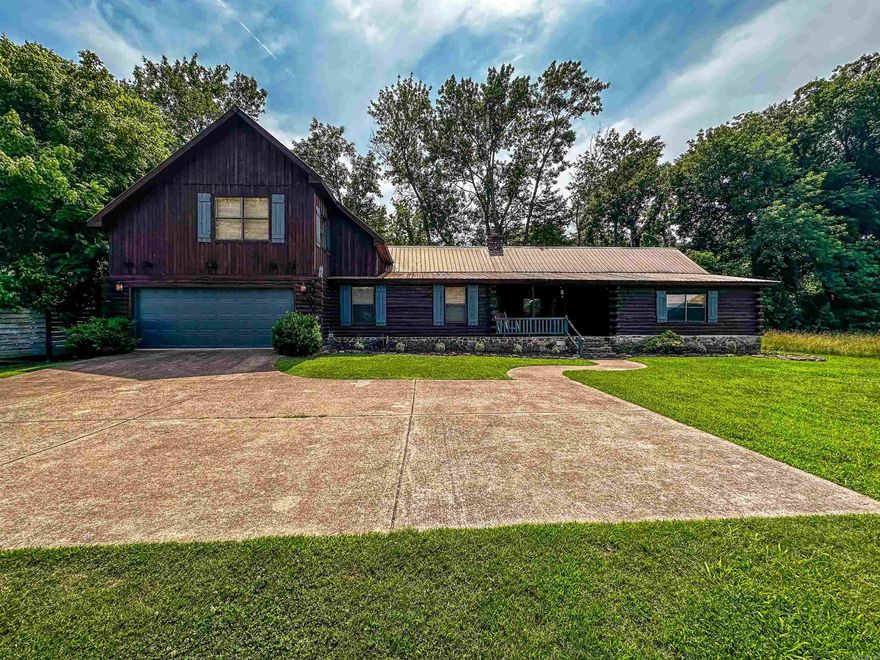 No. 025035 For $575,000, own this stunning multi-level 5-bedroom, 3-bath log cabin nestled on the banks of the White River in Mountain View, Arkansas. With 3,445 sq ft of space, this peaceful retreat offers big porches, a screened-in porch, and a deck overlooking the river. Inside, enjoy two full kitchens, including a galley-style kitchen with river views. The cabin can be divided into two units, making it ideal for nightly rentals. A spacious great room sits above the two-car garage, perfect for a large sleeping area or entertainment space. The master suite features two vanities, and the home comes partially furnished to continue as a successful VRBO or Airbnb. Walk to the river and enjoy the tranquility of this one-of-a-kind riverside escape.