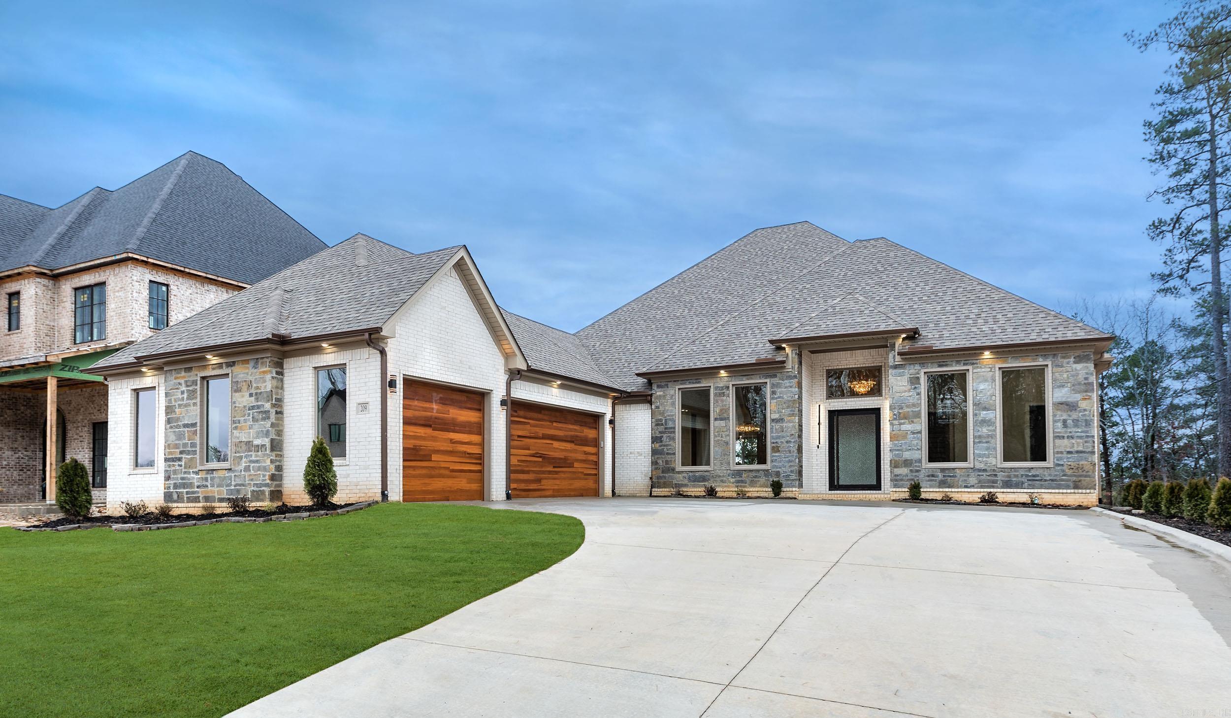 Just completed NEW Construction in Falstone Subdivision of Chenal Valley. Greenbelt behind with walkout backyard. Open floor plan with interior designer paint choices, wallpaper in Dining, Upgraded Lighting. 5 Bedrooms total with master bedroom and mother-in-law suite and 2 other bedrooms on main floor. All have ensuites. Media room with Cabinetry, bar sink, microwave, undercounter refrig. Prewired with Speakers in Media and Living Room, Vernada is prewired. Large glass sliding doors leads out to exterior Fireplace with granite countertop outdoor kitchen with Grill & SS appliances. Kitchen Quartz Island with 2 waterfall Sides. Counter depth 5' SS refrig freezer, double oven, potfiller, gas stovetop, coffee bar with sink undercounter bev cooler, ICE-maker, Butler Pantry. Master Bedroom with fireplace, custom paint, exlarge 2'x4" tile shower with body sprays. Towel Warmer, Master Closet large with pulldown Bars for out of season clothes, Oversized 3 Car Garage with walkout to side yard. Oversize driveway for extra parking space. So close to shopping, restaurants and walking paths. Low E Windows with argon Gas, 2 Tankless Hotwater Tanks, Extra Insulation R-38, Custom Door Hardware