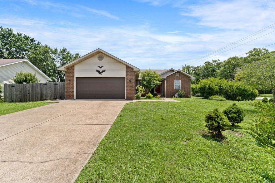 Discover this beautifully designed 3-bedroom, 3-bath brick home offering low-maintenance living on a spacious corner lot near Cooper Park. Featuring a unique layout with two large primary suites—each with its own full bath—this home also boasts a split-bedroom plan for added privacy. The open-concept living area is warm and inviting with vaulted ceilings and a cozy fireplace, flowing into a generous kitchen with breakfast area. Step out onto the peaceful, shaded deck and enjoy stunning views of the meticulously maintained church grounds that border the backyard. The fenced yard is perfect for pets or outdoor entertaining, and the 2-car garage adds convenience. Located less than 5 miles from Buzzard Roost Marina and Lake Norfork access, and close to medical facilities and shopping, this home offers the perfect blend of comfort, style, and location.