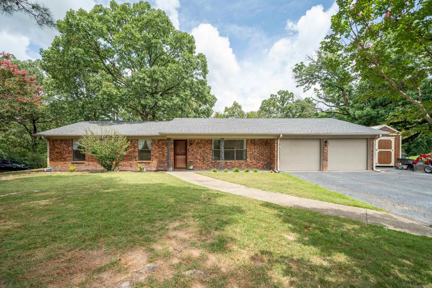 Welcome to your updated 3 bedroom, 2 bath ranch style oasis nestled on 1.78 acres in the sought-after Lake Hamilton School District. This charming home boasts a newly renovated kitchen featuring butcher block countertops and quiet close cabinets, complemented by stylish vinyl plank flooring and fresh paint throughout. Gather around the cozy brick fireplace in the spacious living area, or retreat to the private covered back patio ideal for outdoor relaxation. The master bath offers a luxurious touch with a custom rain head shower. Additional highlights include a convenient 2 car garage, a spacious workshop, and an RV hookup with 50 amp service, water, and septic connections. Enjoy the perfect blend of modern comforts and rural tranquility in this inviting property.