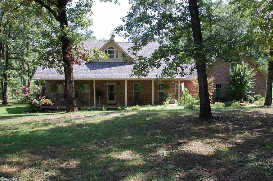 Come see this wonderful serene retreat on approx 9.4 acres with a guest (in-laws/office) house of 1296 Sf ( 2 bds, 1 ba, den & kit), screened porch & pool with a surrounding deck. Open and spacious den with FP opens to kitchen with island and  breakfast bar and an eat-in area. 1 bedrm and master down with sitting room. Office. Upstairs has a large bedroom or gameroom.  2 car garage.  A creek runs through the back portion of the property.  A great home for entertaining!