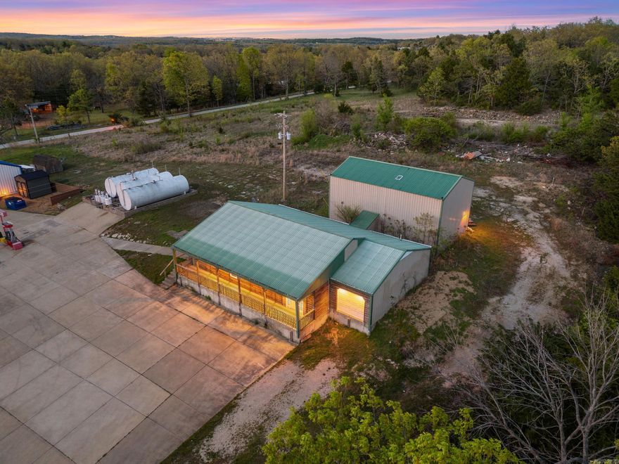 Versatile commercial opportunity with highway frontage on 1.34 acres m/l in Mountain Home, Arkansas! Built in 1997, this 2,060 sq ft metal building offers ample parking and endless potential for a variety of uses including storage, workshop space, retail, office, or recreational purposes. The property features a durable metal roof, garage door access for convenience, and a half bath already in place. Located near Pigeon Creek Access on Lake Norfork, this property offers excellent visibility and easy access while being surrounded by one of the area’s most popular recreational spots. Whether you're looking for a business location, a place to store equipment and toys, or a flexible space to make your own, this property is full of possibilities. Rare combination of location, accessibility, and functionality in a high-traffic area.
