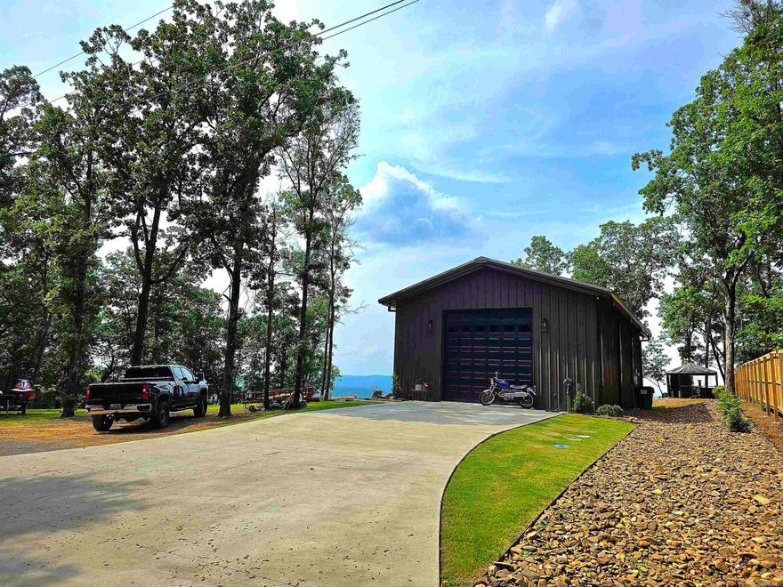 Make it yours!!! The Diamond Bluff area has million-dollar views, but each view is unique in its own way! This custom-built property is ready to make your Greers Ferry Lake view living possible and with so many options available to make it your own. The entire building is heated and cooled with a total of 1586 sq/ft. The building is ready to be lived in now while you build your future home with a full kitchen, full bathroom, and washer and dryer on bottom floor and a bedroom loft directly above that will comfortably fit 2 queen beds which totals 676 sq/ft. The remaining 910 sq/ft clean slate open space could be used as a shop/boat storage or can be additional living/entertaining space which is what it is currently being used as. Square foot measuring encourage. Agents, please see all remarks.