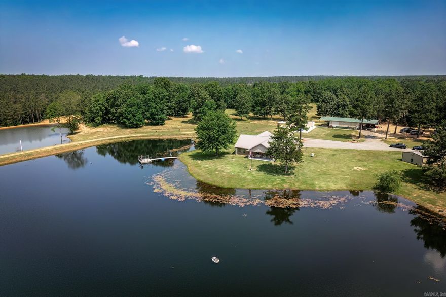 If you are looking for Country Living with a touch of Luxury, then you owe it to yourself to come and view this property today!   Featuring 3 Bedroom, 2 full bath 2012 Built Brick home offering gourmet island kitchen boasting quarts countertops, gas stove which is ideal for the cook in the family, ON DEMAND GAS Water system, pellet stove used for alternate heat during the winter months, massive pull-through Metal Shop & insulated, Second Utility Metal Building which houses the 300 ft well for all your watering needs, In-Ground Pool with pool house with half bath, which is on its own septic system, 2 RV hookups with their very own septic system, 2 fully stocked ponds, ALL UNDERGROUND UTILITIES, on County Water!   HIGHWAY Frontage with the home situated off the highway behind a very large pond.  HIGH SPEED INTERNET!