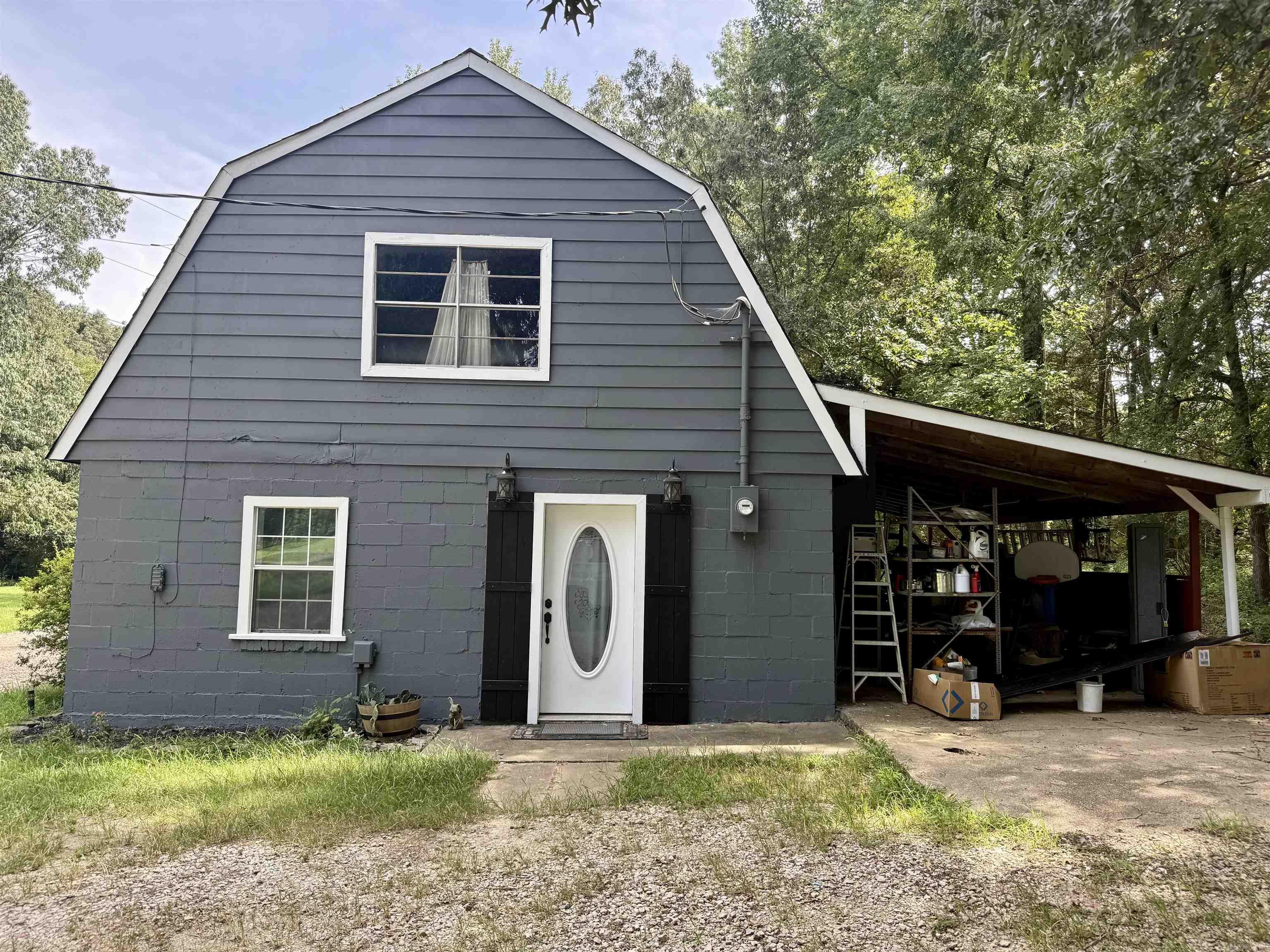 This unique 2-bedroom, 1-bath home is full of potential and sits on a spacious 1.53-acre lot, offering both privacy and opportunity! Inside, you’ll find newly installed LVP flooring throughout (just a couple of strips left to lay – materials are on site and will stay). The kitchen has been refreshed with beautiful refinished upper cabinets, new lower cabinets, and brand-new countertops. The sink and faucet are already purchased and ready to be installed by the new owner. Fresh paint brightens the entire home with the exception of the laundry room. Outside, the home has a fresh coat of exterior paint and a covered side area perfect for storage or a workshop. The upstairs, which is currently only accessible from outside and not heated/cooled, offers over 600 sq ft of additional space. The ductwork could be extended to finish out this area, and the flooring to do so is already purchased and will convey with the sale. The shingles were replaced less than 2 years ago! Whether you’re a first-time buyer, investor, or looking for a project with big upside, this property is a great opportunity to customize and create something special!
