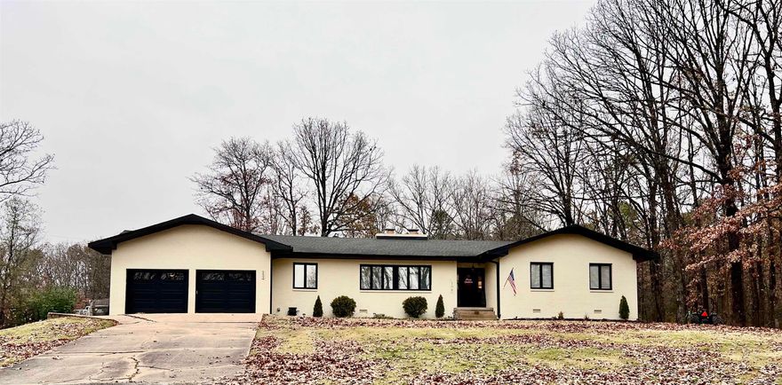 Beautifully renovated 4BR/3BA, 2,770 sq ft home with rich, warm accents and modern upgrades throughout. Features include a separate office, formal and eat-in dining, and two fireplaces (one wood-burning, one gas). The updated kitchen offers custom cabinets, granite, KitchenAid appliances, built-in ice maker, and a large island. All bedrooms include custom closet shelving, and the primary suite boasts a walk-in closet, soaker tub, and large tile shower. LVP flooring in main areas, tile baths, new carpet in bedrooms, plus a spacious laundry room and pantry. Exterior recently painted, a two-car garage with new garage doors, and a large fenced-in backyard.