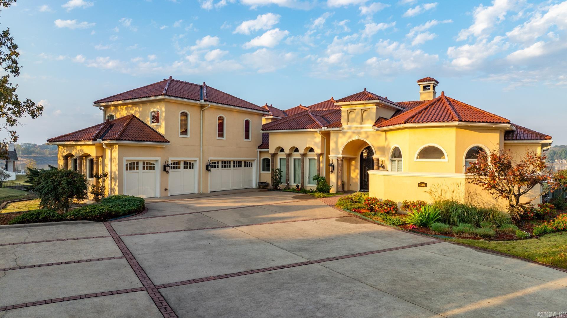 Welcome to your waterfront dream retreat nestled on 1.17 acre in established 800+ household community by Hurricane Lake! Situated on the best lot in the community over a 3-tiered terrace with 2-level massive seawalls, this spectacular custom masterpiece boasts unparalleled luxury and breathtaking panoramic 270-degree lake views. Its long driveways provide you with ample privacy and 20+ car parking capability. Step into a world of elegance and sophistication with 18 foot heavily trimmed ceilings. All rooms, kitchen and sitting areas enjoy open lake views. The chef's kitchen is a culinary delight, it includes top-of-the-line appliances, commercial grade ovens and a built-in Miele coffee maker, perfect for entertaining guests. The oversized master suite is a haven of comfort and the expansive ensuite bathroom let you indulge in the ultimate pampering experience, not to mention a 15'x23' huge his & her walk-in closet with custom cabinetry and wardrobe lifts. Large home theater upstairs with custom leather seating and high-quality theatre grade surround sound. The expansive verandas on both levels ensure you to enjoy the stunning lake views from multiple vantage points.