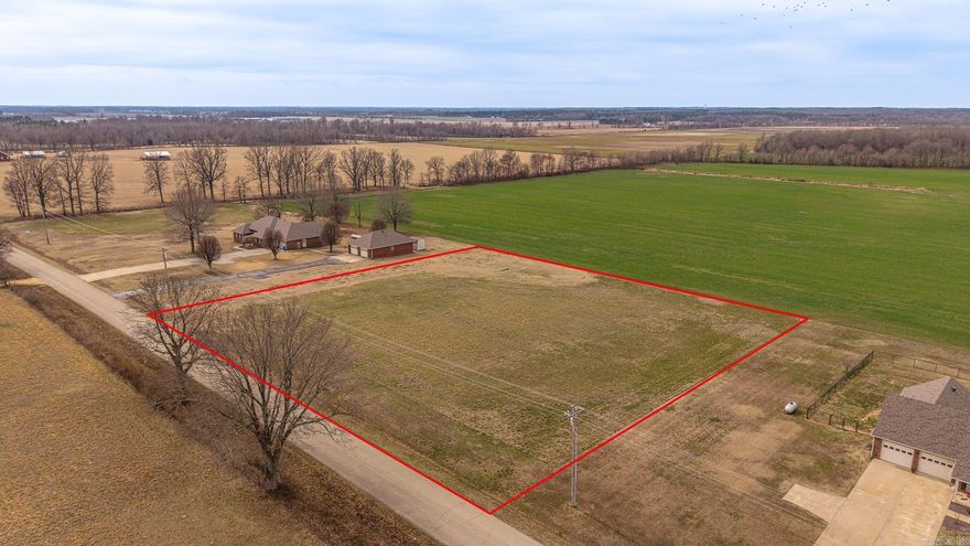 Looking for a beautiful spot to build a home, barndo, shop/house, whatever it is you are looking for this spot is ready for your vision. 2.05 acres newly surveyed, no restrictions, some utilities available and septic would be required  295 ft of paved road frontage and 310 ft deep