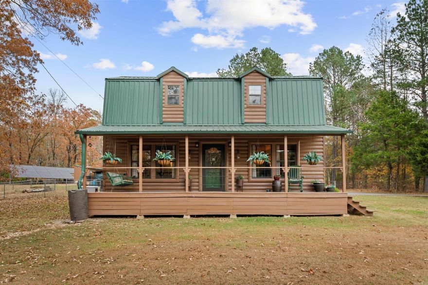 Welcome to your own gated slice of the country—a warm, rustic 2/2 cabin nestled on 5.68 acres of natural beauty. This home features an open layout, wood accents throughout, and plenty of outdoor space to explore. Set up for chickens and small livestock, the property is ideal for anyone dreaming of a simple, self-sufficient lifestyle. Peaceful, private, and full of potential, this cabin is ready to be your next adventure. A dedicated chicken area and coop make hobby farming easy—and the flock is here.  Whether you're seeking a homestead, weekend getaway, or full-time retreat, this cabin delivers comfort, charm, and room to roam.