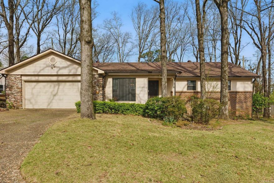 Don't miss out on this thoughtfully designed one-level, cul-de-sac find in West Little Rock's Walnut Valley. Close to everything, including quick and easy access to interstate. 3-bedroom, 2-bathroom spacious layout- vaulted ceilings in living room, window nook, cozy fireplace. Custom cabinetry and built-ins can be found throughout the home in all the right places for ample storage. Multipurpose space with access to backyard includes laundry/mud area, built in desk, and large cabinets for storage. Enjoy updates in recent years including newer appliances, refinished ceilings, bathroom fixtures, LVP flooring, gazebo, HVAC, roof,  garage motor + more for added convenience. Step outside to a large, incredible, landscaped backyard—equipped with a gazebo, and workshop with electricity, ideal for hobbies or extra storage. Come see!