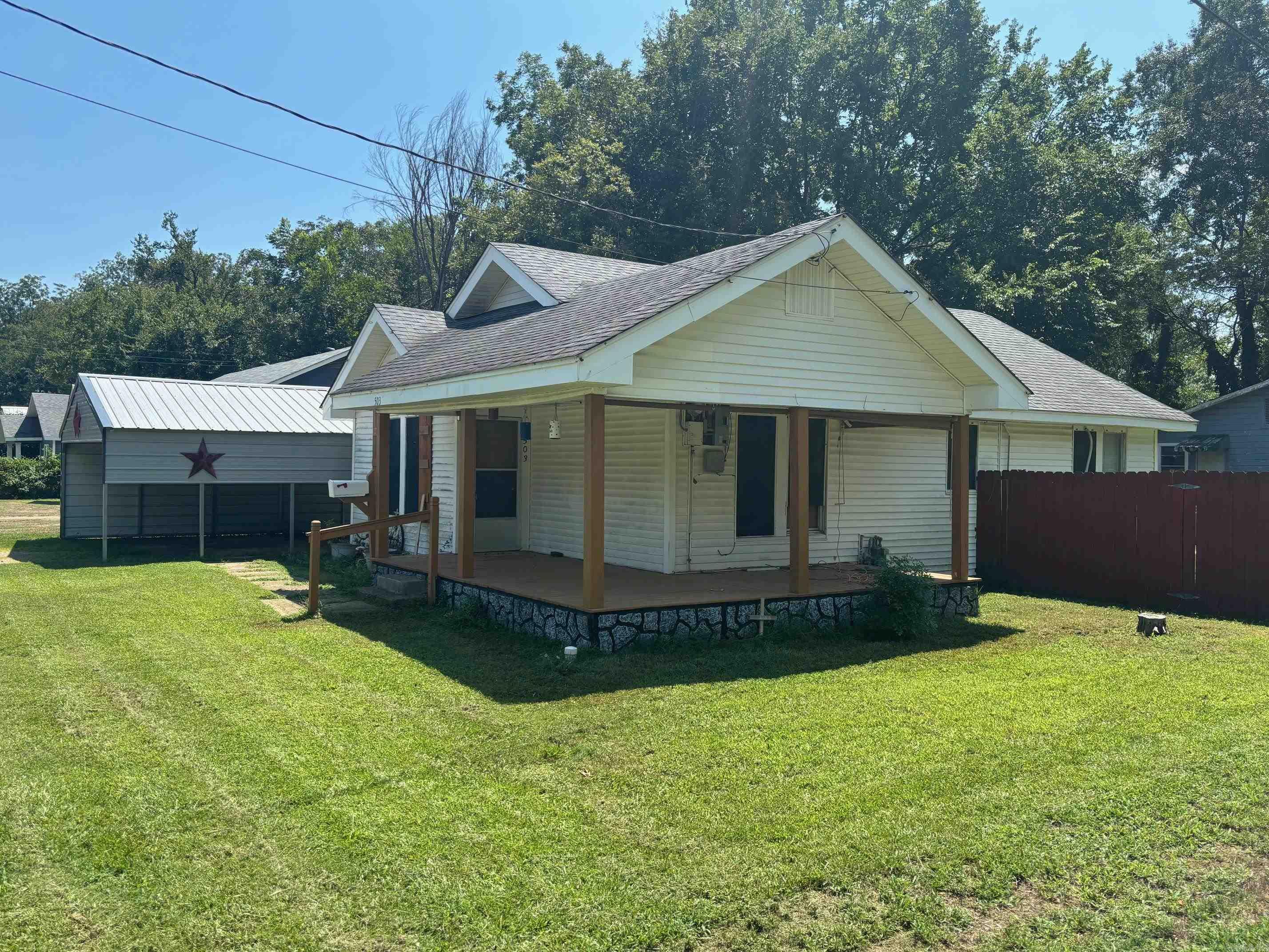 Sitting on a large corner block, you can enjoy the wrap-around front porch while being a few blocks from all the amenities of town and a couple of blocks from Malvern High School. This 2 bd 2 bath house, cedar closet, walk in shower, large jet tub plus a full dining room and breakfast nook, a 22X20 carport that will cover 4 vehicles or a large RV. A storage building/workshop outside and the yard is partially fenced. Lots of updates including crawl space up-to-date with dehumidifier, 2 new mini-splits and paint. Motivated seller!