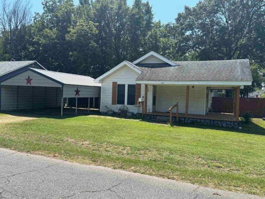 Tired of renting?  This house is sitting on a large corner block, you can enjoy the wrap-around front porch while being a few blocks from all the amenities of town and a couple of blocks from Malvern High School. This 2 bd 2 bath house, cedar closet, walk in shower, large jet tub plus a full dining room and breakfast nook, a 22X20 carport that will cover 4 vehicles or a large RV.  A storage building/workshop outside and the yard is partially fenced.  Lots of updates including crawl space up to date with dehumidifier, 2 new mini-splits and new carpet in the bedrooms. Motivated seller, bring an offer, call or text today for a showing.