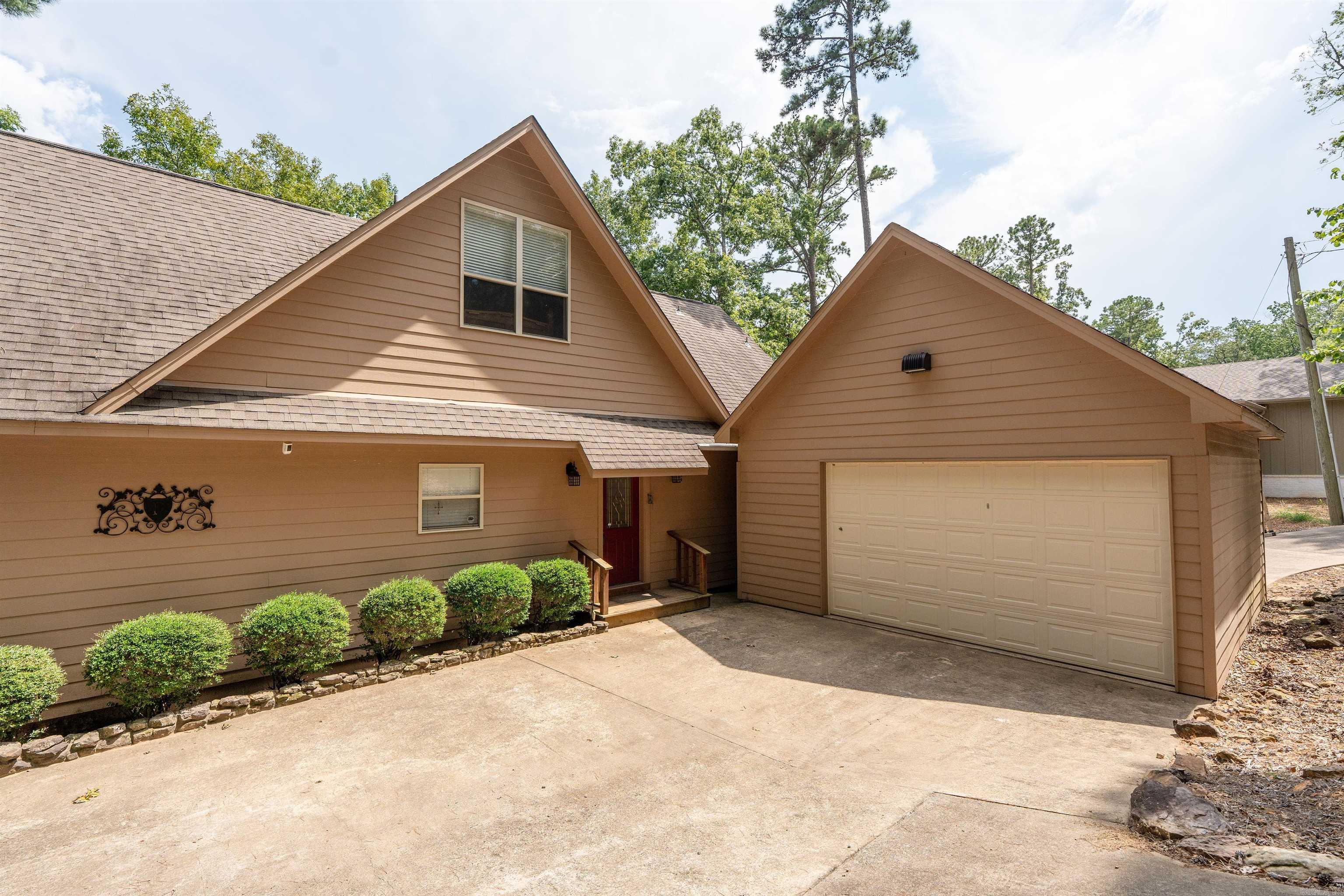 Turn-Key Lake Retreat with Boat, Mule & Lake Views! Welcome to 90 Stone Cr. in beautiful Greers Ferry! This fully furnished 3-bedroom, 3-bath home is ready for you to move right in and start enjoying lake life. The spacious great room features a wood-burning fireplace and large windows overlooking Greers Ferry Lake, creating a warm and inviting atmosphere year-round. Step out onto the relaxing screened in deck and open deck to soak in the views and fresh air, or take advantage of the easy lake access just steps away. Included in the sale is a boat slip in the nearby community dock, a 2006 Harris Float Boat, and a 2012 Kawasaki Muleāeverything you need for fun, adventure, and relaxation. Whether you're looking for a full-time home, a weekend getaway, or a ready-to-go vacation rental, this property offers comfort, convenience, and lake living at its best!