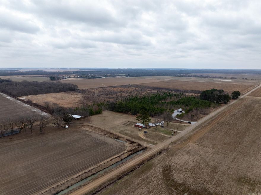 Improvements on this Pumpkin Bend property include the following:  -Cross County rural water in place. -200A electric in place. -New driveway and pad. -All hookups for a 50A RV. -Deer stands. -Duck pond with new grading on the northeast side. -(Camper could be purchased separate and apart from the land. It is not figured into the purchase price.) -1/4 mile from Straight Lake Duck Lodge.  Located in the heart of the some of the best duck hunting you'll find in the southern United States, this CRP Tract is the perfect location to build your duck lodge, have deer hunting right outside your back door, and have an annual return on your investment. This property is located between and less than 10 miles from both the Cache River and Bayou DeView. Investors, you have multiple options. Keep the property as is and enjoy deer and small game hunting with the annual CRP payment. This property is also adjacent to active farms and could be converted back into cultivation when the CRP contract expires.  This property is located right at Pumpkin Bend, 5 miles from Fair Oaks, and less than 8 miles from McCrory.