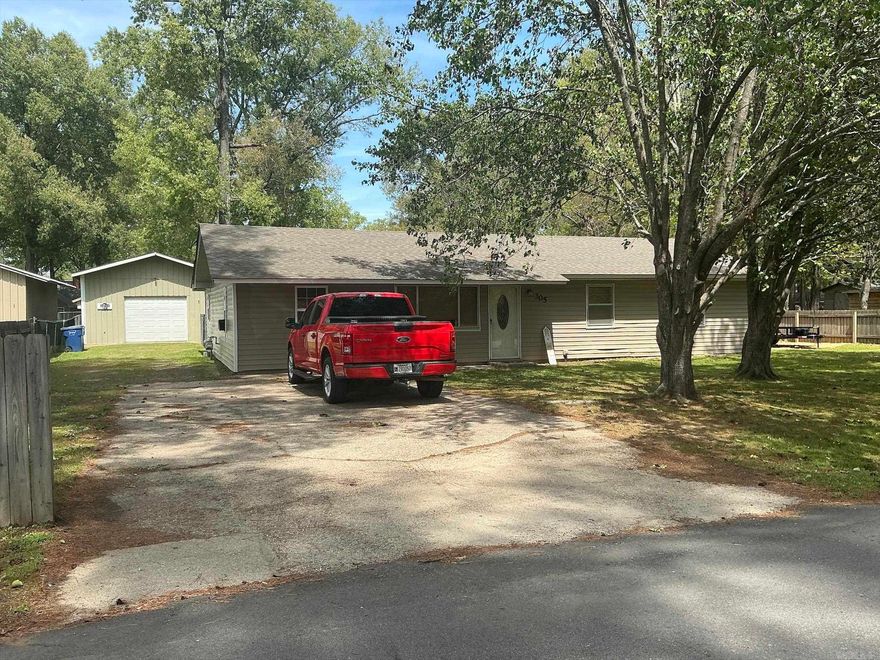 Open space concept with the living room, dining room and kitchen all open to each other with large windows, kitchen features a free standing stove, refrigerator does not remain, walk-in pantry, space  and wiring for a dishwasher, but no dishwasher, hall bath with a large walk-in shower, three bedrooms, a large laundry room, Covered patio porch, a large fenced in back yard, a tool shed with a carport and porch, and a large insulated shop with office and window unit that heats and cools. Central unit is 1 1/2 years old, roof is 2 years old, wiring redone 8 years ago in house, 2 extra electricity in laundry room and bathroom, and extra insulation added to the house.  Great starter home, retirement home or anyone wanting a shop to have a place to do their extra work.  This is one you must see.