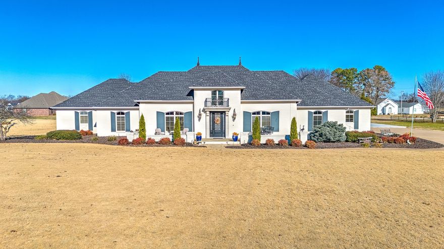 PRICE REDUCED TO $775,000!!! Welcome to a truly exceptional, one-of-a-kind French European estate that surpasses the appeal of brand-new homes. This all-white, fully-bricked masterpiece rests gracefully on over 2 acres of pristine land, boasting an impressive array of top-tier amenities & updates. The home is a testament to luxury living, custom designed open floor plan adorned w/ Volcano Travertine floors throughout & heated floors in Primary Bath. Storage is ample throughout the estate, w/ a generously sized walk-in closet w/ Island, 2 inviting fireplaces + Brand New Custom Outdoor Fireplace, spacious 4-car tandem garage + a 35 X 40 Slab just poured for customization. With its expansive grounds, there's plenty of space to envision your dream pool. This home has been meticulously cared for and is loaded w/ amenities that make it truly stand out. Walking distance to the White River and perfect for kayaking! Don't miss your chance to own this rare gem in East Fayetteville. Schedule a showing today & experience the epitome of luxury living!