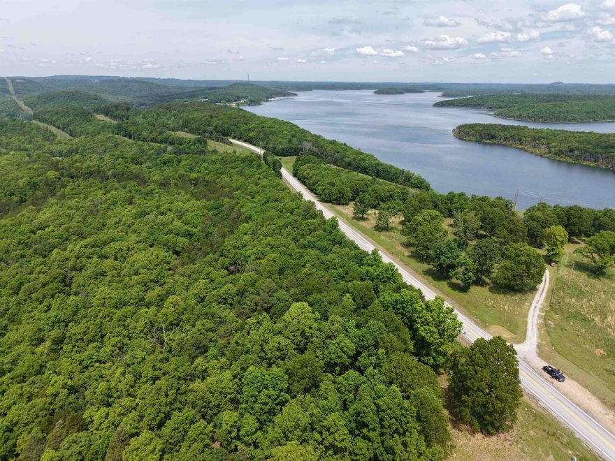 This 6.24-acre tract offers the perfect blend of location, versatility, and opportunity. With prime highway frontage and no restrictions, this property is ideal for development, building your dream home, or creating a private getaway. Situated less than a mile from the world-famous Norfork River and just minutes from Lake Norfork and a public boat ramp, this land provides easy access to some of the best fishing and boating in the Ozarks, making it an even more desirable area for recreational use. This property is even located near the popular Whispering Woods restaurant. Whether you're looking for a recreational retreat or a site for a cabin or vacation rental, this property has it all. Additional acreage is also available for purchase. Don’t miss this rare opportunity for only $49,900— the possibilities are endless! Contact us today to schedule a showing!