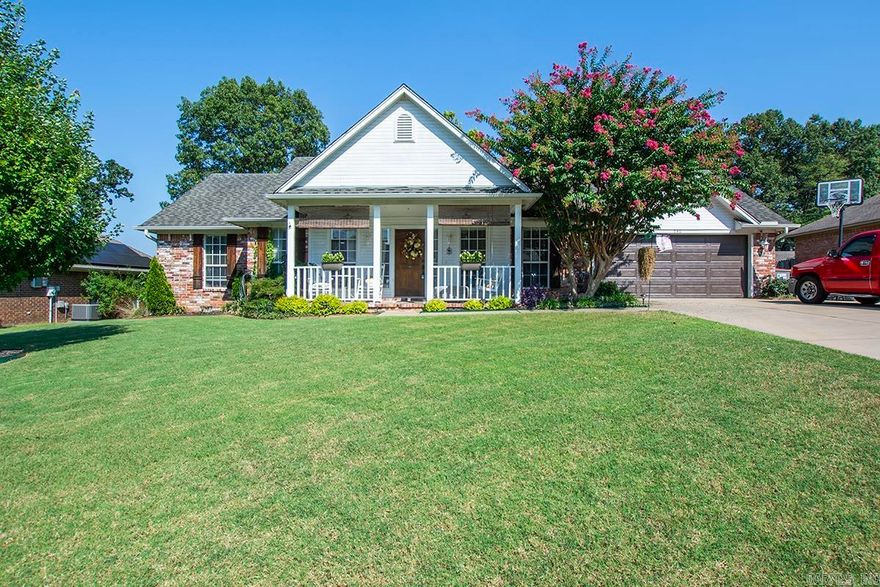 Located in the highly desirable area gf Greenwood, with easy access to all amenities including soon to be bypass. This inviting home offers a mix of modern upgrades and cozy living. The 4-bedroom split floor plan has been upgraded and maintained to offer a move-in ready atmosphere. A eat in kitchen with modern cabinets, upgraded counter tops, sink and newer appliances provides an atmosphere that will make meal preparation a joy. A separate dining area with ample room to make the most of mealtime with family and friends. Large family room with fireplace easily becomes the center of attention. The primary suite is a sanctuary boasting a soaking tub and a walk-in shower and access to outside deck and private back yard. The 3 additional bedrooms with walk-in closets and a second bath with double sinks provides a spacious area for family and guests. Oversized garage and large privacy fenced yard. All this waiting to be seen if you can make it past the covered front porch with ample room for swing and rockers.