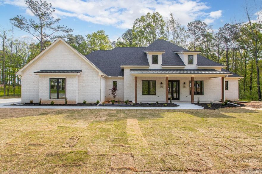 Beautiful New Home in the Scenic Hazel Oak Subdivision... Amenities include: Approximately 3892 Square Feet, 5 Bedrooms, 4 1/2 Bathrooms, Living/Dining Combo, Kitchen/Dining Combo, Open Floorplan concept, Split Bedroom Floorplan, 4 Bedrooms Down, Bonus Room/5 Bedroom upstairs with full bathroom and closet, Large Primary Bedroom, Primary Bathroom has walk-in custom tile shower and separate free standing tub, Living Room with Fireplace, Kitchen has an abundance of cabinets - large island - Breakfast Bar - gas range - double wall oven, Nice Pantry, Large Laundry Room with cabinets and sink, Office, Safe Room built in to closet, Front Sitting Porch, Large Covered Patio, Sitting on nice Tree Shaded 1.47 acre lot +/-, And Much More.... This is Truly a Custom Built Home... A Must See....