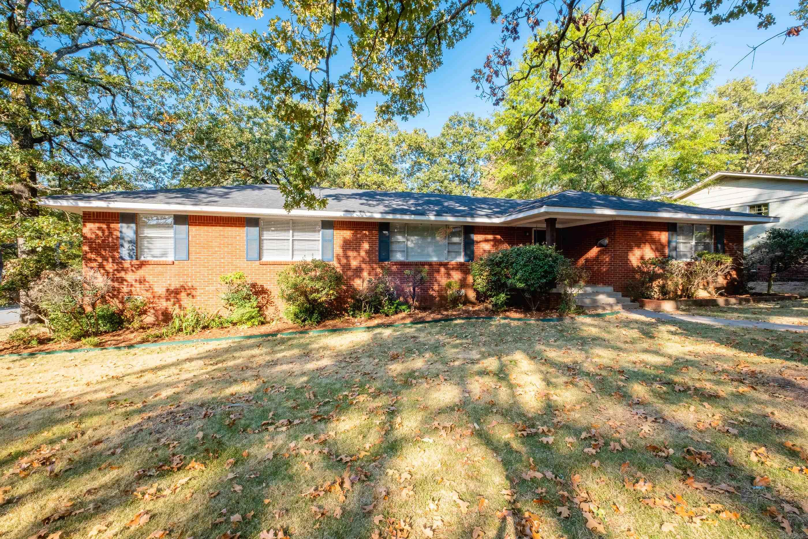 Beautiful one-level, brick home sitting on a corner double lot and conveniently located in Midtown! The spacious living/dining room combo, large eat-in kitchen and den/second living area make this home ideal for entertaining. Additional room adjacent off den/second LR is perfect for home office/craft room, or could even be converted into large walk-in closet! Oversized, flat backyard with patio is fully fenced. Updates/improvements include gorgeous, newly refinished hardwood floors throughout most of the house, freshly painted interior, a completely remodeled primary bathroom with walk-in shower, water heater (2022), architectural shingle roof (2020), HVAC (2019) and more! Large 2 car, side-load carport. Be sure to ask about the assumable loan at 3.5% interest rate! See AR for showing information.