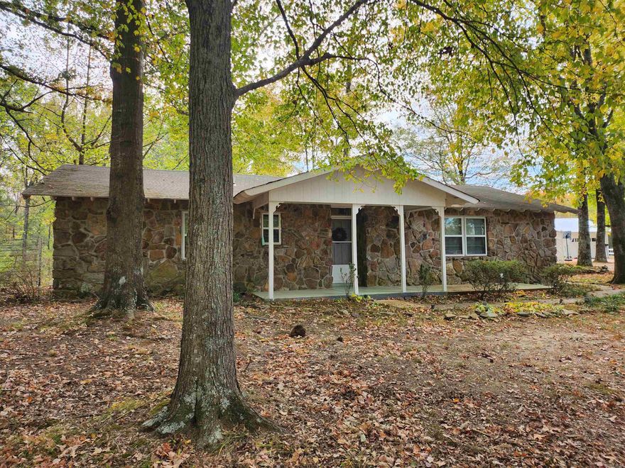 This super cute house is ready for a new owner.  Close to town and interstate for easy commuting.  It's a 2 bed, 2 bath with big kitchen, dining room and large laundry/pantry room.  Primary is oversized with its own bathroom.  House is on a little more than 4 acres, with a 30x40 shop with electric and a barn.  Long driveway and lots of mature trees.  Very tranquil and peaceful.  Flood insurance is required and will qualify for 0% down USDA-RD ELIGIBLE.  Sq. Ft. is approx. measuring encouraged.