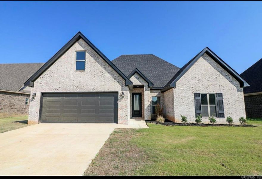 The home you have been waiting for with custom choices throughout! Welcome to the market 133 Clearwater, located in the Hidden Creek subdivision, just minutes away from the highly sought after schools at Brookland! Built in 2023, 133 Clearwater is located in a great neighborhood with side walks throughout, perfect for afternoon walks. This family home features a 2-car garage, 4 bedrooms, 2 baths, and over 2,200 sq foot of living space. The main level is an open concept floor plan with high ceilings, lots of tall windows, wide planked hardwood floors, and neutral colors that will appeal to every buyer. The large living room is open, filled with natural light, has a beautiful electric fireplace that can be used year round, as well as French doors leading to the back yard. The kitchen is open to the living and dining spaces, and comes equipped with granite countertops, beautiful cabinetry, and stainless steel appliances including a gas stove. The main level primary suite features a large walk-in closet with customs built-ins, his and her vanities, generous sized tiled shower, and a deep soaker tub. Leading upstairs to the fourth bedroom is a set of carpeted stairs with a beautiful cus