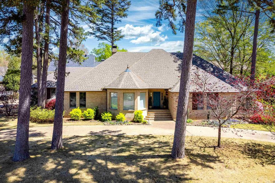 Beautiful one level brick home on desirable Chenal Circle. This well maintained property features stunning hardwood floors throughout and a spacious, light-filled layout. The huge eat in kitchen features abundant custom cabinetry, granite countertops, gas range, and stainless steel appliances. Enjoy entertaining in the formal dining room and the expansive great room, which showcases a coffered ceiling, built-ins, wet bar, and an impressive gas log fireplace all framed by a wall of windows. The generous primary suite offers a luxurious bath with jetted tub, updated finishes, and two closets. Two guest bedrooms also share a updated bath, while a fourth bedroom/office is located near a third full bath. A large laundry room with extra storage adds convenience. Enjoy outdoor living with a covered patio, large decks, and a fenced yard with updated gates. Additional updates include fresh interior paint, new gutters, fencing, fixtures, and more. Two car garage. Come see!
