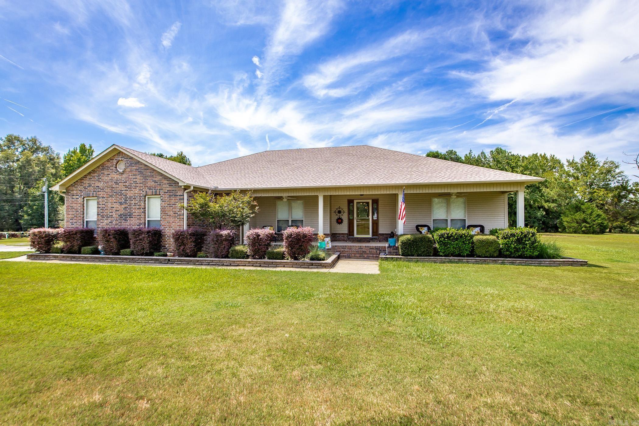 Custom built home on 3 level, country acres! Enjoy your tree shaded drive to your piece of privacy! Plenty of acreage for cool, swimming pool, shop, garden...your choice! Flowing floor plan is designed for plenty of family time with three living areas! Bring your pool table or ping pong table and you are ready! Luxury vinyl flooring for easy care and great for pets of the family! HUGE screened patio is perfect to relax after a long day at work or school! Kitchen is lovely with granite countertops, beautiful soft painted cabinetry and modern appliances. Even a center island! Cozy wood burning fireplace for those winter evenings. Enjoy drinking sweet iced tea on the front porch watching life go by! Refrigerator stays and washer & dryer negotiable. See agent notes!