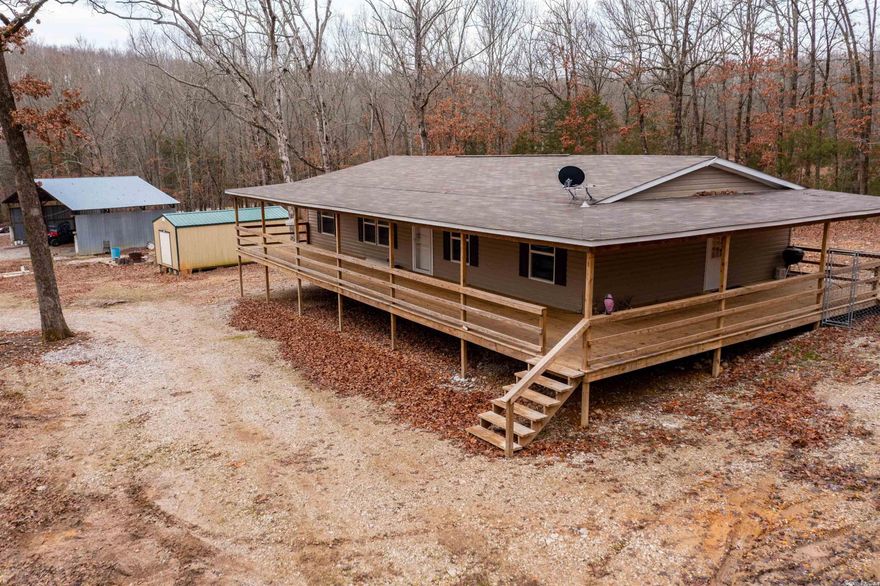 330 +/- Acres, a 2020 Doublewide Mobile, A Cabin overlooking Curia Creek, Curia Creek runs through the property, Another Cabin and all furnished.  This is a hunting camp that has 3 places to stay!  County Water and Electric is at the new, 2020 Clayton Mobile.  There is a machine shed and another 2 storage buildings.  Please read additional documents for more info!